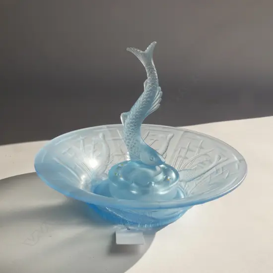 A pale blue depression glass flower bowl